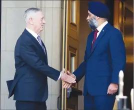  ?? AP PHOTO ?? Jim Mattis (left) and Harjit Sajjan shake hands during a meeting at the Pentagon.