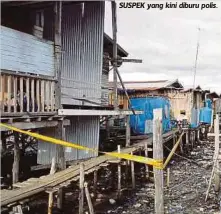 ??  ?? LOKASI mangsa dibunuh suaminya di rumah Kampung Pinggir Bakau, Semporna.