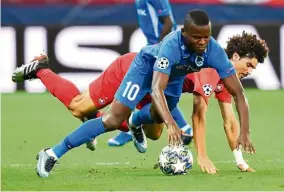  ?? — AFP ?? Smart choice: Genk forward Mbwana Ally Samatta (in blue) has been described by his coach Felice Mazzu as a complete forward, good with both feet, technical and skilful.