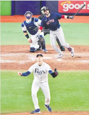  ?? GETTY IMAGES ?? The Red Sox’ J.D. Martinez clubs a tiebreakin­g three-run home run in the fifth inning Friday.