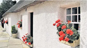  ??  ?? Thanks to reader John Crichton for this photo showing how blooms at the National Trust for Scotland cottages in Glamis have been providing a splash of summer colour.