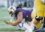  ?? Elaine Thompson ?? The Associated Press Washington’s 340-pound defensive tackle Vita Vea sacks UCLA quarterbac­k Josh Rosen in a Pac-12 game on Oct. 28 in Seattle.