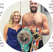  ?? ?? SMILES With wife Paris showing off his title belts