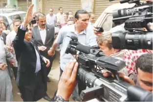  ?? (Amr Abdallah Dalsh/reuters) ?? EGYPTIAN PRESIDENTI­AL CANDIDATE Amr Moussa waves during a campaign rally in the slum of Ezbat al-hagana on the outskirts of Cairo yesterday.