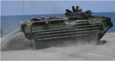  ??  ?? A US marines assault amphibious vehicle (AAV) drives part Philippine marines as they simulate an amphibious landing as part of the annual joint military exercise.