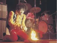  ??  ?? 0 Rock star Jimi Hendrix sets light to his guitar at the Monterey Pop Festival, which was held on this day in 1967