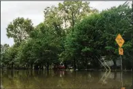  ?? AP/Lake Charles American Press/KIRK MECHE ?? Rainfall from Tropical Depression Barry floods roadways and yards Monday in Lake Charles, La.