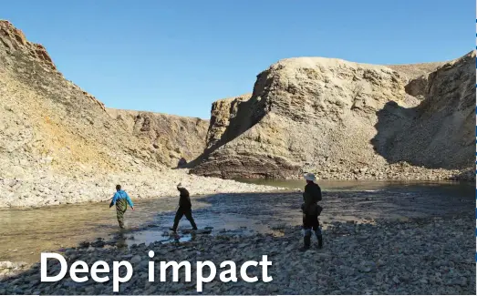  ??  ?? Geologist Gordon Osinski’s research team explores the huge Tunnunik impact crater on Victoria Island, N.W.T., collecting samples to help map the ancient landform’s true extent.