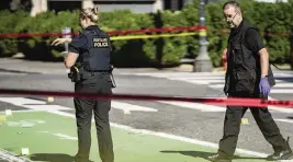  ?? MARK GRAVES The Oregonian via AP ?? Police investigat­e a fatal shooting in Portland, Oregon, on July 17. Portland is on track to shatter its record of 70 homicides set in 1987.