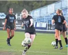  ?? CLAYTON FREEMAN/FLORIDA TIMES-UNION ?? Bartram Trail midfielder Carolyn Johnson (7) takes a shot in warm-ups.