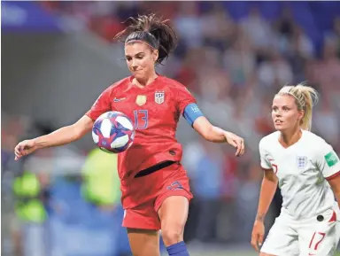  ?? PHOTOS BY MICHAEL CHOW/THE REPUBLIC ?? United States forward Alex Morgan (13) controls the ball as England’s Rachel Daly defends in the first half of Tuesday’s semifinal in the Women's World Cup near Lyon, France.