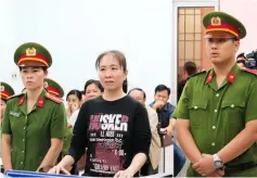  ?? — AFP photo ?? File photo shows prominent Quynh (centre) attending her appeal trial at a local people’s court in the central coastal city of Nha Trang.