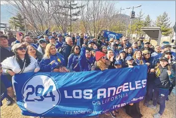  ?? Mark Potts Los Angeles Times ?? MEMBERS OF FAN GROUP PANTONE 294 made the 6,000-mile trip to South Korea for the Dodgers’ season-opening series, even though most didn’t have tickets to the games and had to watch in local bars.