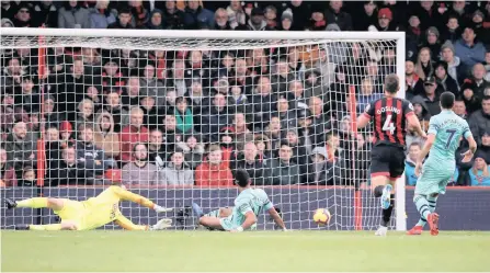  ?? | REUTERS ?? PIERRE-EMERICK AUBAMEYANG scores Arsenal’s second goal against Bournemout­h at the Vitality Stadium yesterday.