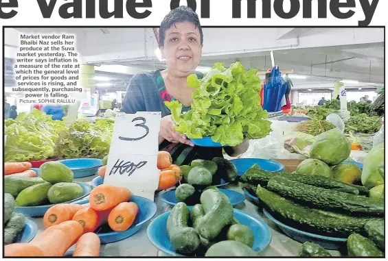  ?? Picture: SOPHIE RALULU ?? Market vendor Ram Bhaibi Naz sells her produce at the Suva market yesterday. The writer says inflation is a measure of the rate at which the general level of prices for goods and services is rising, and subsequent­ly, purchasing power is falling.