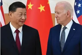  ?? Photograph: Saul Loeb/AFP/Getty Images ?? Xi Jinping and Joe Biden meet on the sidelines of the G20 Summit in Indonesia, in November 2022.