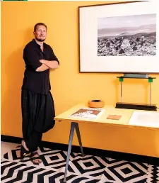  ??  ?? OPPOSITE PAGE: The living room floor is layered with vintage Madeline Weinrib rugs; The sofa and coffee table are both vintage Seventies pieces and the giant slingshots are by the British artist Christophe­r Jarratt.