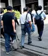  ?? AFP ?? leGal ReCoURse: the man walks with his legal team as they enter a tokyo court to attend a first hearing of the case. —