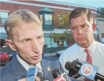  ?? STAFF PHOTO, BY STUART CAHILL; STAFF PHOTO, LEFT, BY PATRICK WHITTEMORE ?? WHAT DID THEY KNOW, WHEN DID THEY KNOW IT: Boston police Commission­er William B. Evans speaks to reporters yesterday about reports of Las Vegas shooter Stephen Paddock investigat­ing Boston venues as Mayor Martin J. Walsh looks on. Gov. Charlie Baker,...