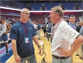  ?? GAVIN KEEFE/THE DAY ?? UConn men’s basketball coach Dan Hurley, left, talks with former UConn assistant George Blaney on Friday night during the Jim Calhoun Charity All-Star game.