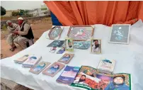  ?? AFP ?? Books and posters on offer at the shrine of Mumtaz Qadri. —