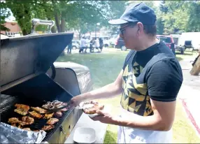 ??  ?? Pablo Ubeda prepares rice and beans, pork ribs and homemade tortillas for Grupo Latino at the Festival Latino festival in Galt Gardens on Saturday. @JWSchnarr Herald