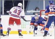  ?? Bruce Bennett / Getty Images ?? Islanders goaltender Semyon Varlamov makes a second-period save against the Rangers’ Colin Blackwell on Saturday.