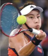  ?? XINHUA ?? Wang Qiang hits a return to Daria Gavrilova during Wednesday’s third-round match at the WTA Wuhan Open. Wang Qiang,