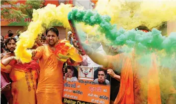  ?? — BIPLAB BANERJEE ?? BJP workers celebrate after party win in Karnataka Assembly elections at the party headquarte­rs in New Delhi on Tuesday.