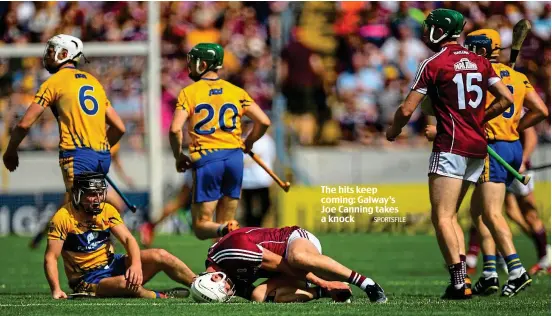  ?? SPORTSFILE ?? The hits keep coming: Galway’s Joe Canning takes a knock