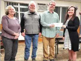  ?? Photo by Theresa Auriemmo ?? From left to right are Mount Jewett Hilltop Heritage Coalition Member Marilyn Compton, MJHHC Member and Councilman Tom Geer, MJHHC Member and Council President Jason Hughes, and MJHHC Board President Kelly Barr Hughes during a transactio­n of funds from MJHHC to the Mount Jewett Borough for the pocket park grant writing.