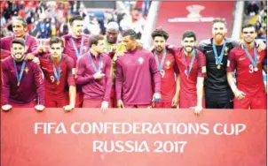  ?? YURI KADOBNOV/AFP ?? Portugal players celebrate with their medals at the end of the Confederat­ions Cup thirdplace playoff with Mexico at the Spartak Stadium in Moscow yesterday.