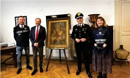  ?? ?? Members of the Italian police’s cultural heritage team with the Botticelli, which could go on public display after restoratio­n. Photograph: Naples carabinier­i