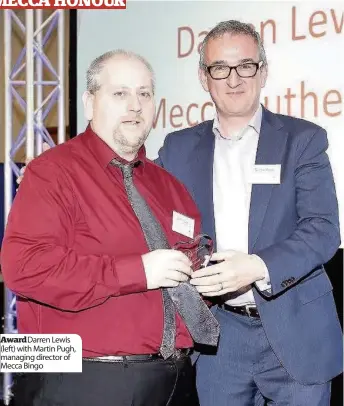  ??  ?? Award Darren Lewis (left) with Martin Pugh, managing director of Mecca Bingo