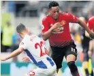 ??  ?? ROCKED Martial on the charge against Brighton but United were beaten 3-2