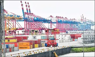  ?? (AP) ?? In this file photo, containers are stored in the free harbor in Bremerhave­n, Germany. The German government says the country’s economy is in a weak phase but it doesn’t currently see indication­s it will enter a long-term
recession.