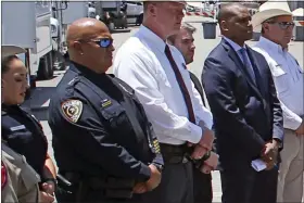  ?? DARIO LOPEZ-MILL-ASSOCIATED PRESS FILE ?? Uvalde School Police Chief Pete Arredondo, second from left, stands during a news conference outside of the Robb Elementary school in Uvalde, Texas, on May 26.