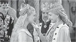  ?? JAAP BUITENDIJK ?? Prince Phillip ( Harris Dickinson) introduces fiancee Aurora ( Elle Fanning) to dad King John ( Robert Lindsay) and Queen Ingrith ( Michelle Pfeiffer).
