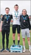  ?? Photograph: Andrew Leinster. ?? Mattis Robertson (UHI) on the podium with Craig Paterson (left), and Finn McHenry (right), both University of Glasgow.