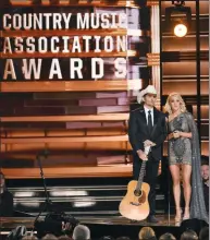  ?? PHOTO BY CHARLES SYKES/INVISION/AP, FILE ?? This November 2016 file photo shows hosts Brad Paisley, left, and Carrie Underwood at the 50th annual CMA Awards in Nashville, Tenn. The 51st annual CMA Awards will air live on Wednesday.