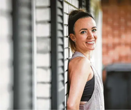  ?? Photos by Jon Shapley / Staff photograph­er ?? Renata Holland, a furloughed group fitness instructor, now holds daily online workout classes from her home.