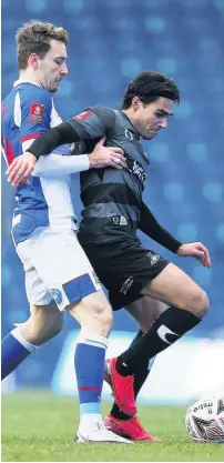  ?? Tim Markland ?? Doncaster Rovers’ Bacup-born midfielder Reece James, right, in action