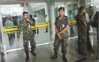  ??  ?? BANGKOK: Thai soldiers block the entrance of Phramongku­tklao Hospital in Bangkok after a bomb wounded more than 20 people, in Bangkok.—AP