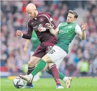  ?? ?? Lewis Stevenson challenges Liam Boyce