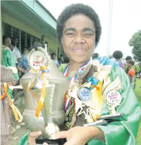  ?? Ronald Kumar. ?? Noco Secondary School dux of the year, Alumita Qeramaitog­a with her awards following their annual prize giving ceremony on November 16, 2017.Photo:
