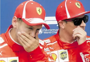  ?? GP-B.LD: BUUST ?? Gngespannt­e Gtmosphäre: Die Ferrari-Piloten 0ebastian Rettel (links) und Kimi Uäikkönen nach dem Qualifying in Monza, wo Uäikkönen auf die Pole-Position fuhr.