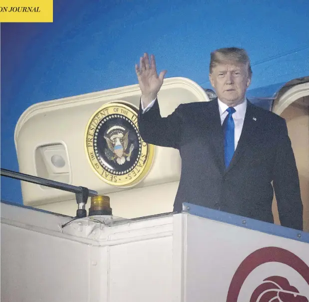 ?? SAUL LOEB / AFP / GETTY IMAGES ?? U.S. President Donald Trump waves after Air Force One arrives at Paya Lebar Air Base in Singapore on Sunday ahead of his planned meeting with North Korea’s leader Kim Jong Un. Trump used time on the plane to send tweets undoing work just accomplish­ed by G7 leaders in Quebec.