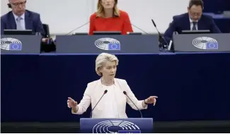  ?? ?? EU Commission President Ursula von der Leyen addresses the European Parliament as its president Roberta Metsola looks on, July 18, 2024