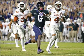  ?? AP Photo/Ron Jenkins ?? ■ TCU running back Darius Anderson (6) runs for a touchdown as Texas defenders Malcolm Roach (32) and DeShon Elliott (4) pursue during the second half Nov. 4, 2017, in Fort Worth, Texas. The Longhorns are looking today to prove they’re back and halt a trend of domination by Big 12 rival TCU.