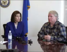  ?? AP PHOTO/SCOTT SONNER ?? David Pritchett, a furloughed worker for the U.S. Bureau of Land Management, looks on as Sen. Catherine Cortez Masto, D-Nev., talks to reporters Friday in her office in Reno about the impacts of the partial government shutdown. Pritchett, a BLM planner in Reno, says the effects of the shutdown will have a ripple effect on federal land management long after the government fully reopens because of deadlines that were missed for federal permits on a whole range of projects, from gold mines to large recreation­al events.